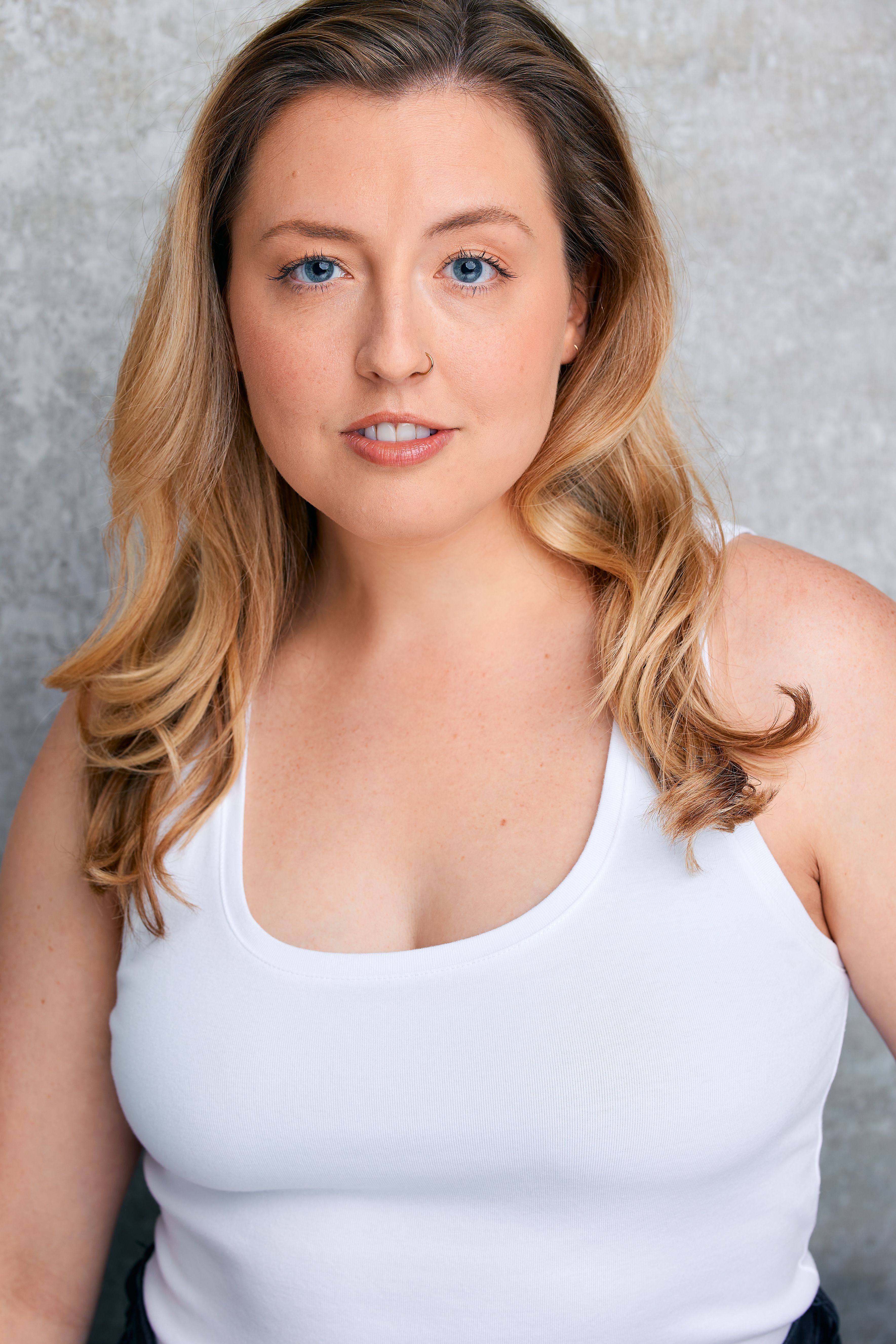 Grace White Tank Sporty Headshot.